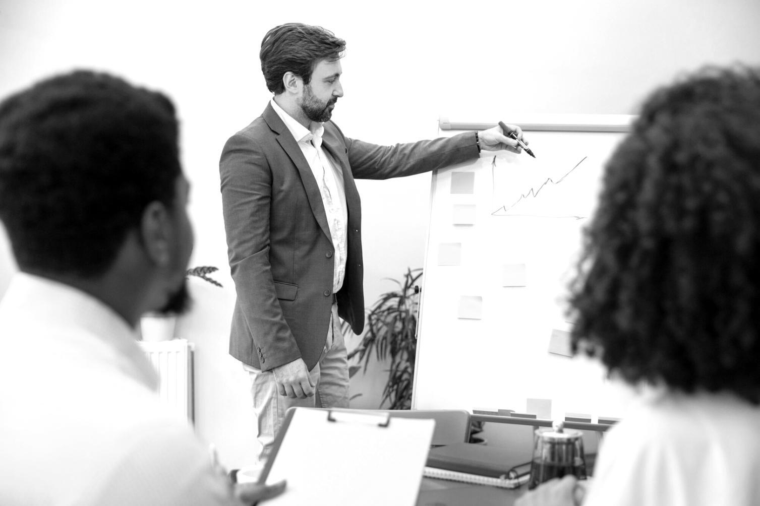 Financial analysts reviewing research methodologies and market analysis